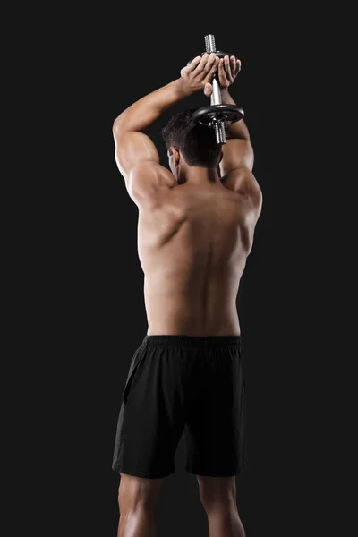 Muscular man lifting weights — Stock Photo, Image