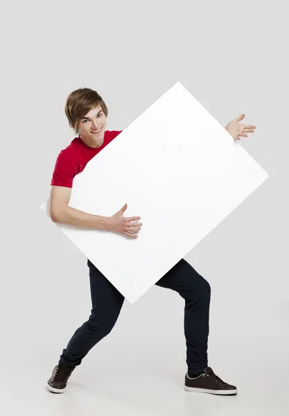 Man holding a cardboard — Stock Photo, Image