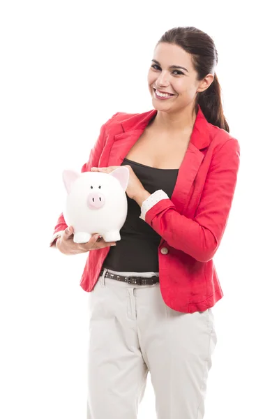 Mulher de negócios com um banco porquinho — Fotografia de Stock