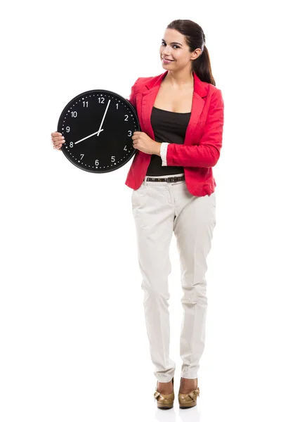 Femme d'affaires tenant une horloge — Photo