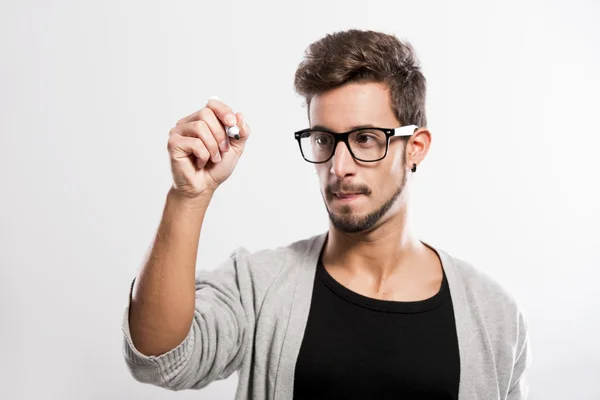 Young man writing on a glass — Stock Photo, Image