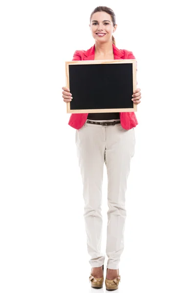 Mujer de negocios sosteniendo un tablero de shalk — Foto de Stock