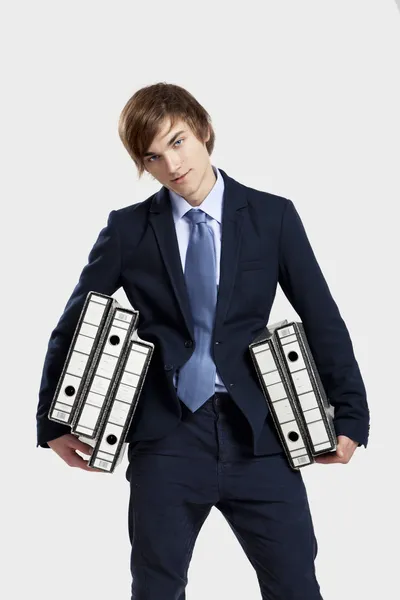 Business man carrying folders — Stock Photo, Image