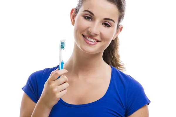 Mulher bonita com uma escova de dentes — Fotografia de Stock
