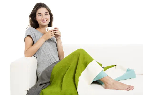 Drinking tea on the sofa — Stock Photo, Image