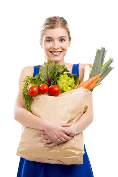Mulher carregando legumes — Fotografia de Stock