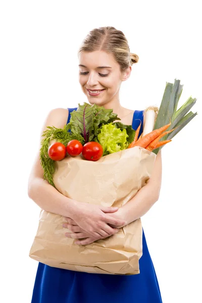 Mulher carregando legumes — Fotografia de Stock