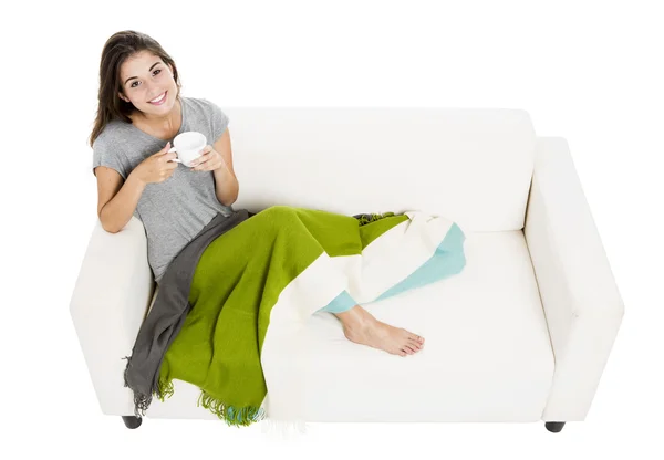 Drinking tea on the sofa — Stock Photo, Image