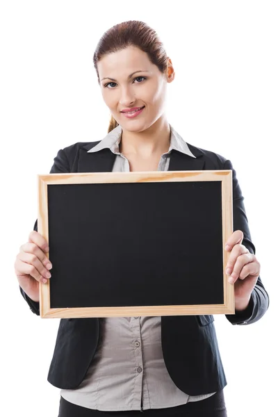 Mulher de negócios segurando um quadro de giz — Fotografia de Stock