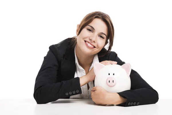 Mulher de negócios com um banco porquinho — Fotografia de Stock