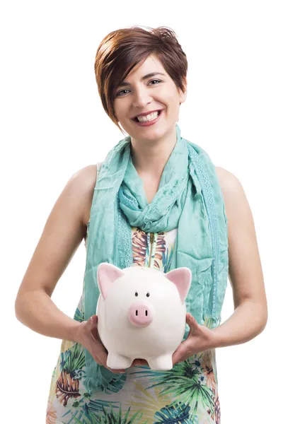 Happy woman with a piggy bank — Stock Photo, Image