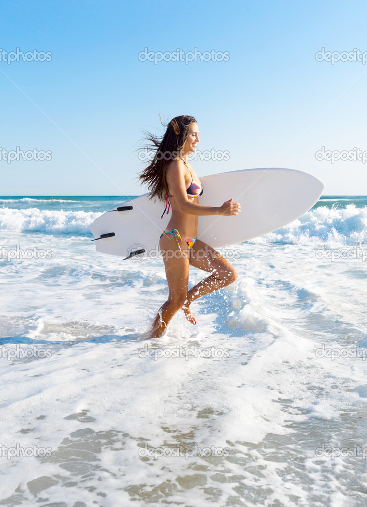 Surfer girl at the beach