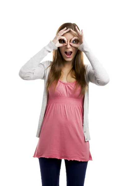 Woman making a silly face with hands on the eyes — Stock Photo, Image