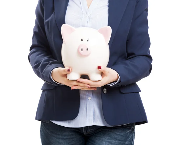 Mujer de negocios con una alcancía — Foto de Stock