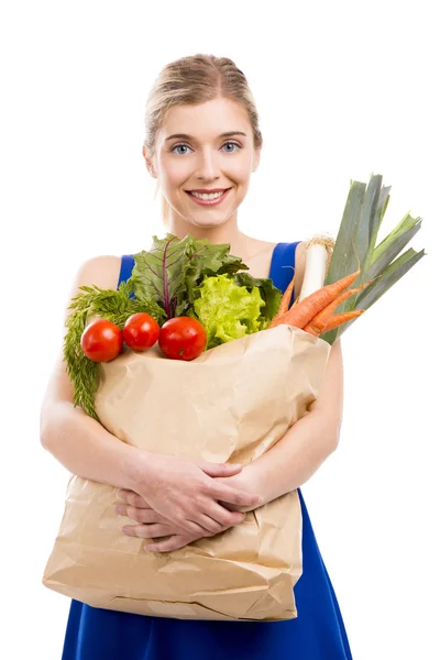 Mulher carregando legumes — Fotografia de Stock