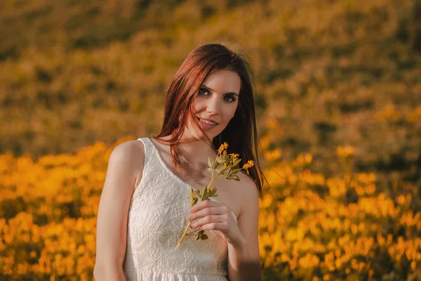 Happy Woman Holding Wild Flowers — Stock Photo, Image