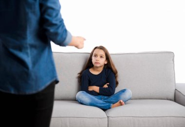 mother rebuking her a little child for bad behavior