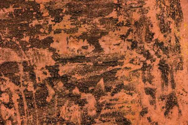 Pintura naranja descolorida sobre capa gruesa de alquitrán negro sobre chapa de acero — Foto de Stock