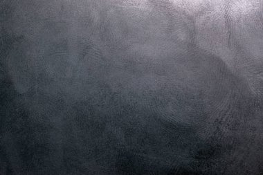 Siyah plastik yüzey, birden fazla parmak izi, makro fotoğraf.