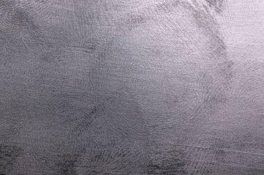 Siyah plastik yüzey, birden fazla parmak izi, makro fotoğraf.