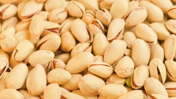 Looped rotating pistachios full frame close-up background — Stock Video