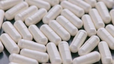 Beyaz ilaç hapları kapsüllerinin tam kare döngü makro tıbbi geçmişi