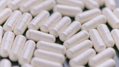 Beyaz ilaç hapları kapsüllerinin tam kare döngü makro tıbbi geçmişi