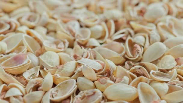 Looped Rotating Empty Pistachios Shells Full Frame Close Background — Stok Video