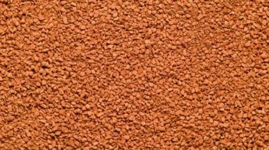 Dondurulmuş hazır kahve taneciklerinin tam kare döndürme arka planı - yukarıdan aşırı yakın çekim.