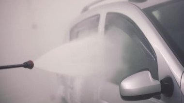 High pressure water cleaning self-service indoor car washing process.