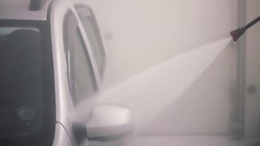 High pressure water cleaning self-service indoor car washing process.