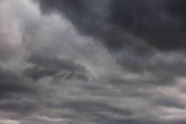 abstract full-frame background of overcast sky with solid cover of grey clouds