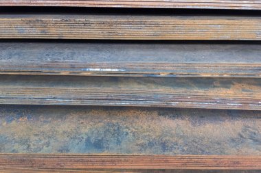 stack of mild steel sheets, full-frame close-up view with selective focus