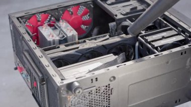 dust blowing of black atx persolnal computer case, closeup with slow motion