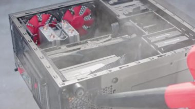 dust blowing of black atx persolnal computer case, closeup with slow motion