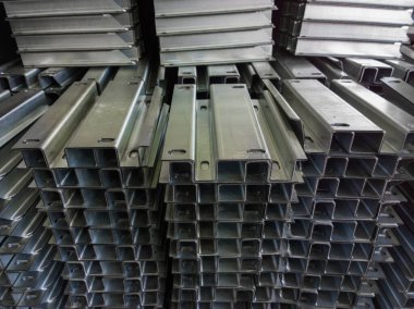 full frame view on stacks of profile bent sheet metal parts