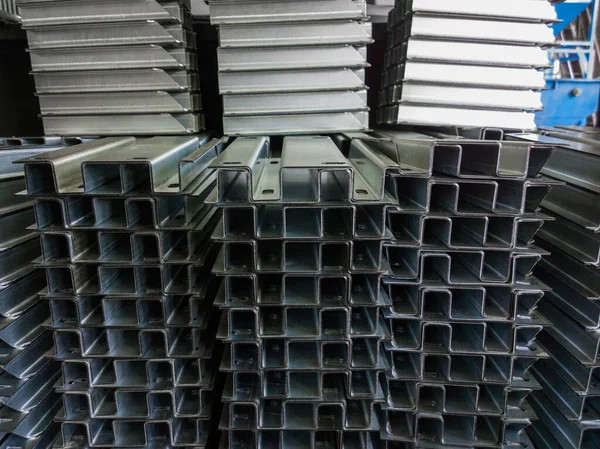 Full frame view on stacks of profile bent sheet metal parts — Fotografia de Stock