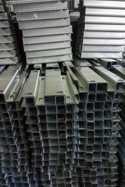 full frame view on stacks of profile bent sheet metal parts
