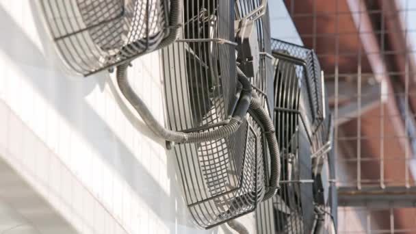 Outdoor air conditioner condenser fans slowly decelerating and stopping — Stockvideo