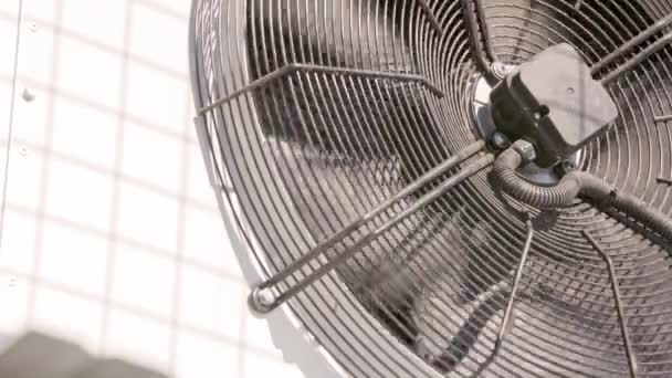 Outdoor air conditioner condenser electrical fan spinning — Stockvideo