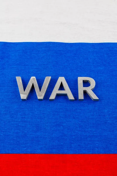 The word war laid with silver metal letters on Russian Federation tricolor flag — 스톡 사진