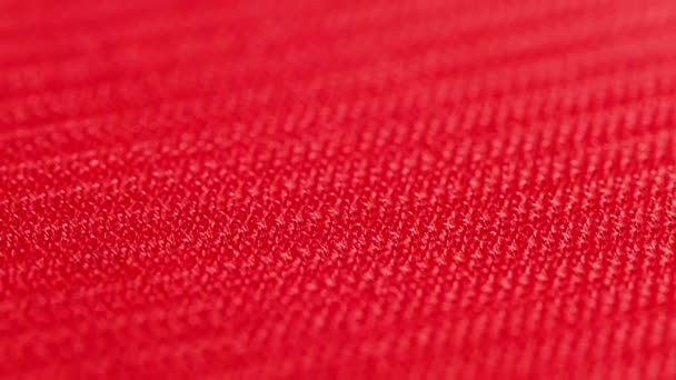 Close-up macro view of red velcro surface with micro hooks — Video