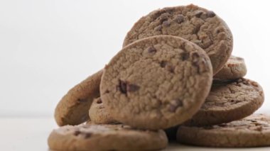 round chip cake cookies with chocolate on white surface slow rotating