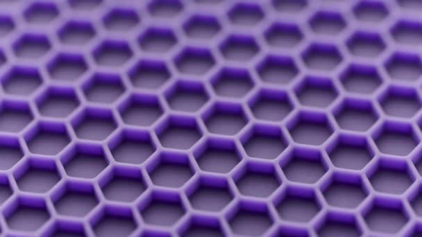 Abstract purple honeycomb pattern looped spinning full-frame background — Vídeo de Stock