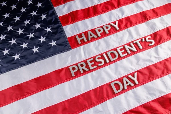 Words happy presitdents day laid with real letters on US flag surface — Stockfoto