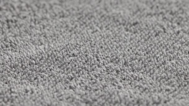 Closeup loopable background of gray soft cotton towel — Stock Video
