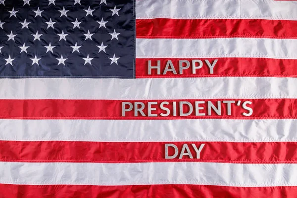 Words happy presitdents day laid with real letters on US flag surface — Stockfoto