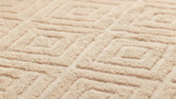 Closeup loopable background of beige soft cotton towel — Vídeos de Stock