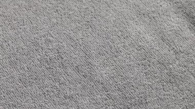 closeup loopable background of gray soft cotton towel
