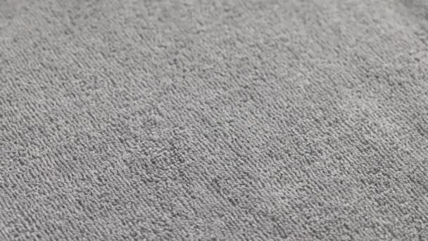 Closeup loopable background of gray soft cotton towel — Stock Video